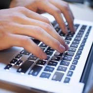 image of person typing on computer