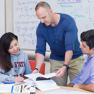 Professor working with students.