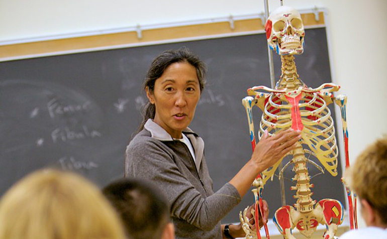 Kinesiology professor demonstrates using skeleton