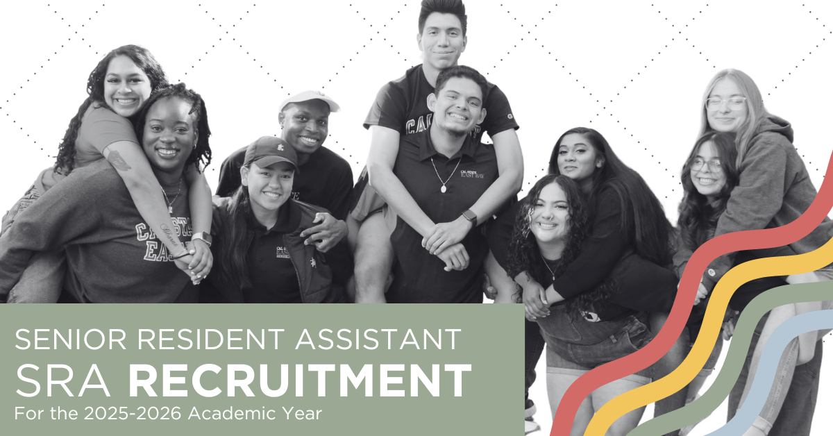 Picture of 4 student leaders wearing Cal State East Bay apparel standing in front of a residence hall with their arms around each other and laughing. 