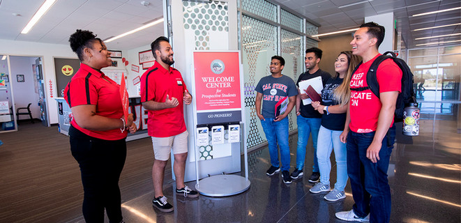 Students and group tour guides at the CSUEB Welcome Center