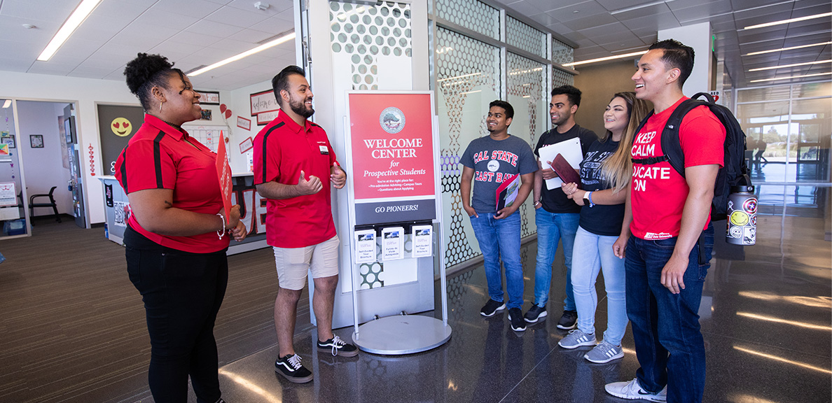 Students and group tour guides at the CSUEB Welcome Center